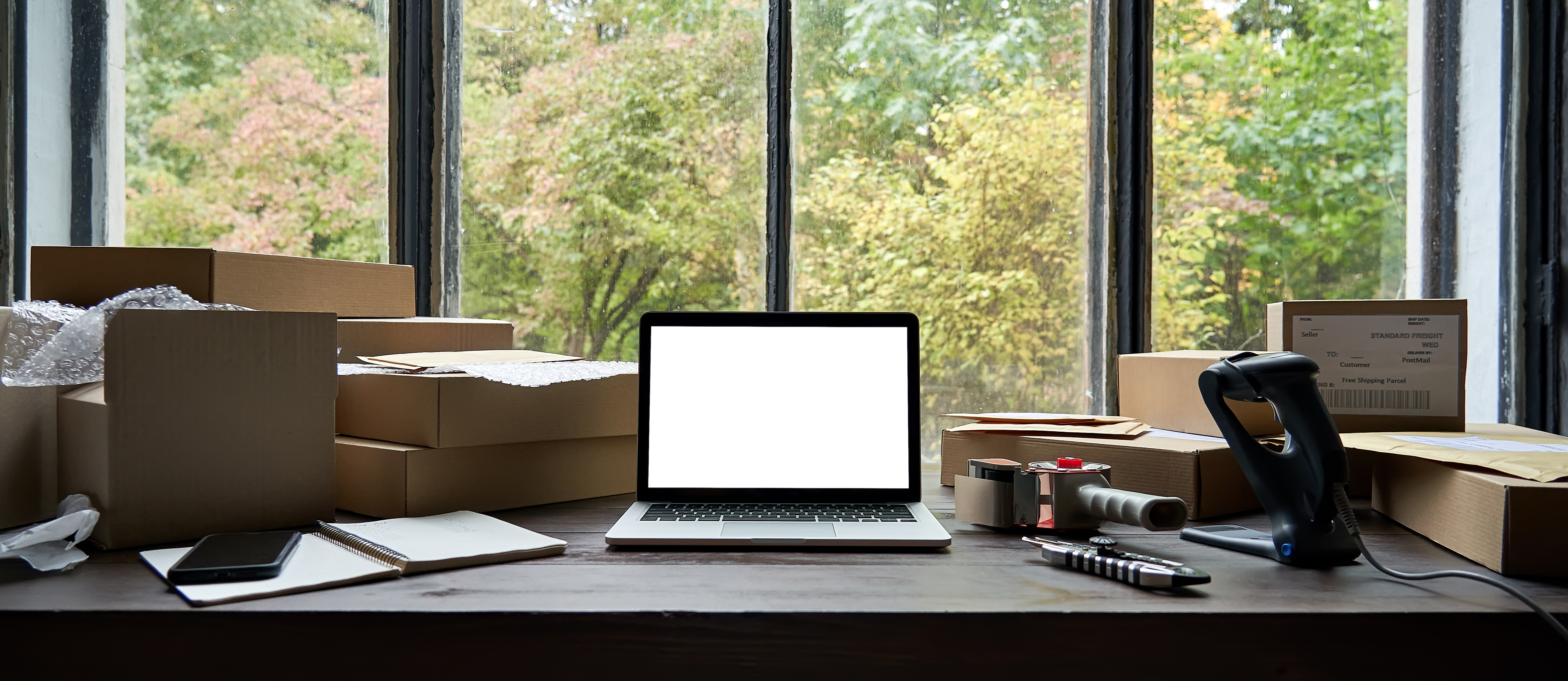 table-with-laptop-mock-up-screen-and-boxes-ecomme-2021-09-02-07-22-46-utc